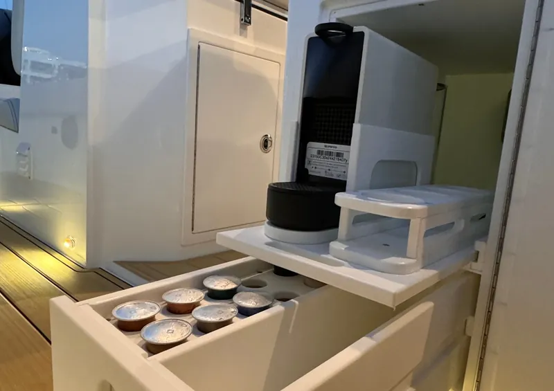 Fitted galley cabinets and a built-in cooktop