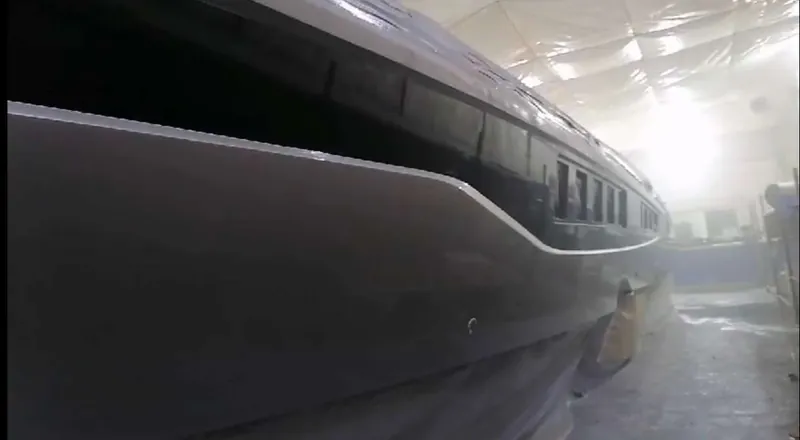 A dark-painted hull inside the workshop